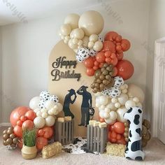 an image of a birthday party setting with balloons and decorations on the wall in front of it