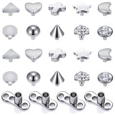 an assortment of various metal objects on a white background