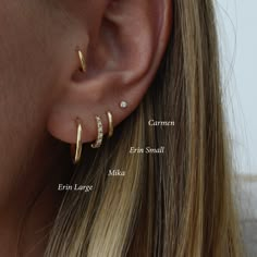 three different types of ear piercings on a woman's ear