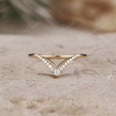 Unique Moissanite Wedding Band Yellow Gold Moissanite Curved Wedding Ring Art Deco Stacking Matching Chevron Ring Promise Rings For Women ITEM DETAILS ●Available in yellow, white or rose solid 10k, 14k or 18k gold. This ring can be made in Platinum. ❀❀Wedding band  Stone: Moissanite Shape: Round Shape Weight: about 0.106ct Band width around 1.3mm Visit my shop for more jewelry: https://www.etsy.com/shop/TheRoseCastle if you would like to customize your unique ring, you may contact us about your ideas and pictures. Hope I could get the chance to create fabulous rings for you! ❀Production ---- This ring is handmade and very good quality! Please allow 2-4 weeks for production. It can be made to any ring size.  ❀Engraving service We accept the engraving order, leave a note when placing an orde Yellow Gold Chevron Wedding Band, Marquise Rings, Chevron Wedding Band, Wedding Band Yellow Gold, Curved Wedding Ring, Wedding Ring Art, Wedding Rings Art, Chevron Wedding, Stacked Wedding Rings