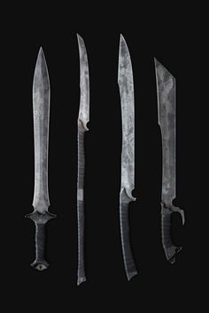 four knives are shown in the dark with their blades still attached to each other,