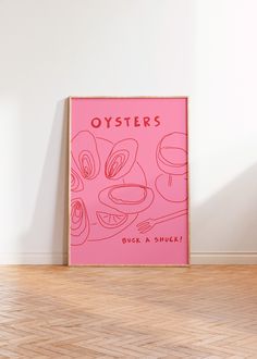 a pink poster with the words oysters on it in front of a white wall