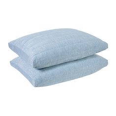 two blue pillows sitting on top of each other