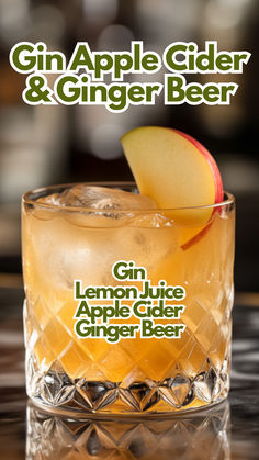 the gin apple cider and ginger beer is served in a glass with an apple slice