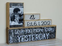 two wooden blocks with pictures on them and the words, i love you more today than yesterday