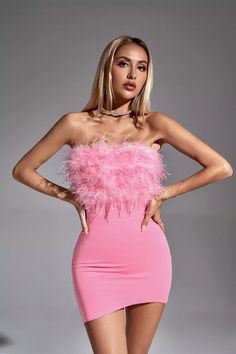 Our Annabelle Pink Feather Dress is sure to wow the crowd at your next special event! It's made from pink polyester and features an off-the-shoulder chic bodice and fitted skirt. Feathers adorn her neckline, adding a unique allure to the little dress. Simply complete the look with heels!  Dress Length: Approx 72cm Materials: Polyester Gentle Dry Clean Only  The model is 5 ft 7 and wears size S  Color may vary due to lighting on images. The product images (without a model) are closest to the true Pink Feather Dress, Glitter Wedding Dress, Heels Dress, Bandage Midi Dress, Floral Shirt Dress, Pink Feathers, Feather Dress, The Plaza, Puff Sleeve Dresses