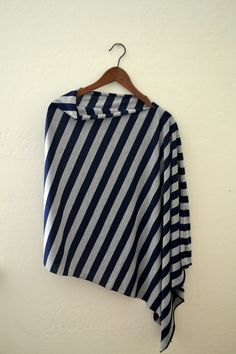 a blue and white striped shirt hanging on a wall