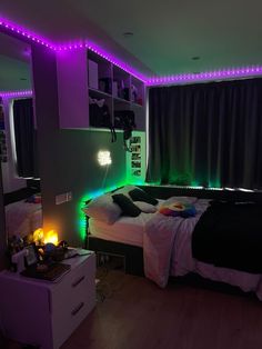 a bed room with a neatly made bed and purple lights