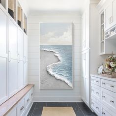 a painting hanging on the wall in a kitchen