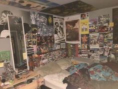 a bed room with a bunch of posters on the wall