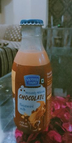 a bottle of chocolate milk sitting on top of a table