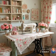 a sewing machine sitting on top of a table in a room filled with pink flowers