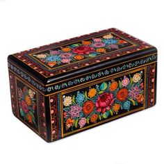 a decorative box with flowers painted on it