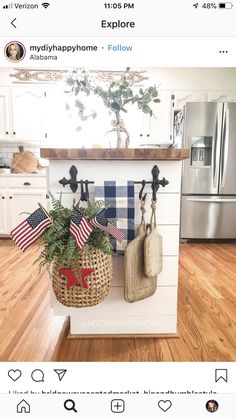 a potted plant sitting on top of a kitchen counter next to two cutting boards