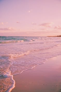 an ocean beach with waves coming in to shore