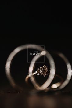 two rings sitting on top of each other with the words, the harvest above them