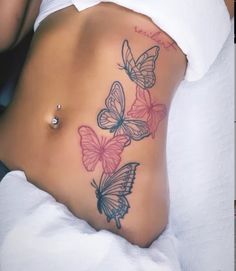 a woman's stomach with butterflies on it