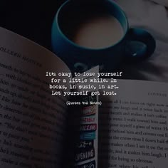 an open book with a cup of coffee next to it