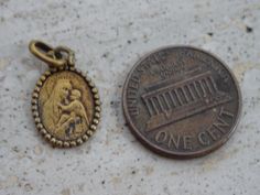 Religious antique French vermeil gold plated medal pendant medaillon medallion of Holy Mary Our Lady with Child Jesus and Holy Christ. The measures of the vermeil gold plated medal with loop are : 0,43 x 0,66 inches ( 1,09 x 1,68 cm ) I bought the medal on a brocante ( fleamarket ) in France. I deliver all over the world. Registered shipping is possible and is costing 22 US dollars. If you haven't Paypal, you can pay by bank transfer. I have a lot of this medals. If you have a question feel free Antique Brass Charms For Collectors, Commemorative Coin Pendant, Antique Gold Charms For Collectors, Antique Gold Charms, Child Jesus, Holy Mary, Bank Transfer, Our Lady, Virgin Mary