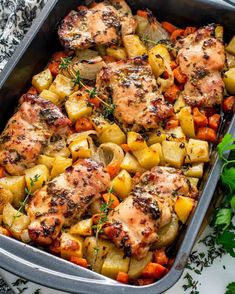 chicken, potatoes and carrots in a casserole dish with parsley on the side