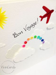 a greeting card with the words bon voyage written on it and an airplane in the sky