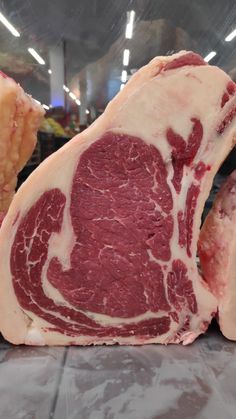 raw meat on display in a grocery store