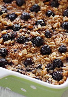 a casserole dish filled with blueberries and granola