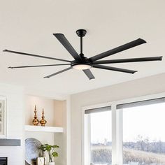 a black ceiling fan in a living room