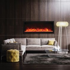 a living room filled with furniture and a fire burning in the wall above it's fireplace