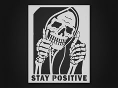 a black and white image of a skeleton holding a knife with the words stay positive test negative