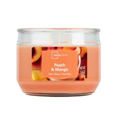 peach and mango candle in a glass jar