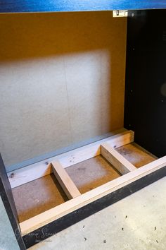 the inside of a wooden box with no drawers