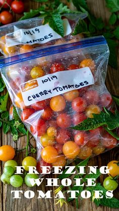 two bags filled with fresh tomatoes sitting on top of a wooden table next to green leaves