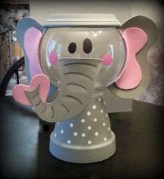 an elephant statue sitting on top of a table