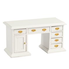 a white desk with gold handles and drawers