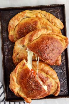 Meat calzones on a baking sheet with one cut open and cheese pulling out of it. Calzone Aesthetic, Calzone Recipe With Pizza Dough, Calzone Recipes, Calzone Recipe Easy, Awesome Sandwiches, Pillsbury Pizza, Fun Meals, Stromboli Recipe, Calzone Recipe