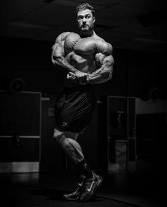 a man standing in the middle of a gym