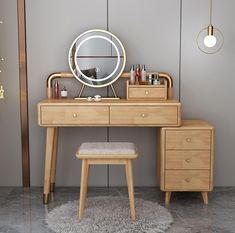 a dressing table with a mirror and stool