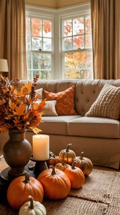 a living room filled with furniture and lots of pumpkins