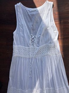 A white peasant dress, perfect for Spring/Summer. Fabric is very lightweight, it is sheer so you will need a slip or something underneath it. Could also be worn over a bathing suit. Fits Women's size M/L best.  Please let me know if you have any questions. All sales are final. Bohemian Sundress With Lace Trim For Vacation, Bohemian Lace Trim Sundress For Vacation, Summer Maxi Dress With Lace Trim For Beach, Spring Beach Boho Dress With Lace Trim, Bohemian Sundress With Lace Trim For Summer, Summer Maxi Dress With Lace Trim For Beach Season, Sheer Maxi Dress For Spring Festival, Summer Dress With Lace Trim For Beach, Bohemian Sheer Maxi Dress For Festival