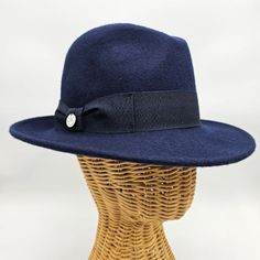 Step back in time with our Women's 1930's Wool Felt Hat, a timeless accessory that channels the elegance and grace of a bygone era. Crafted with meticulous attention to detail, this hat is inspired by the iconic fashion of the 1930s, offering a perfect blend of vintage charm and modern sophistication. Made from high-quality wool felt, this hat boasts a classic silhouette that captures the essence of 1930s style. With its medium brim and tailored design, it exudes understated elegance and complem Formal Wool Cloche Hat With Adjustable Fit, Formal Adjustable Wool Cloche Hat, Classic Adjustable Brimmed Cloche Hat, Adjustable Curved Brim Gatsby Hat, Gatsby Style Adjustable Hat With Curved Brim, Adjustable Gatsby Hat With Curved Brim, Vintage Adjustable Fedora In Solid Color, Classic Cloche Hat With Adjustable Short Brim, Classic Adjustable Wool Hat