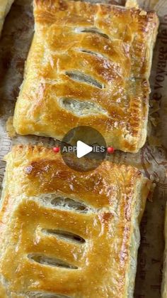 two pieces of bread sitting on top of a pan covered in wax paper with the words appliques