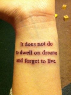 a person with a wrist tattoo that says it does not do so well on dream and forget to live