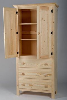 a wooden cabinet with two doors and drawers