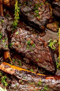 some very tasty looking steaks with herbs on it's head and in the middle