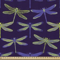 blue and green dragonflies on purple background