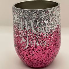 a pink and silver glittered wine glass with the words i am queen on it