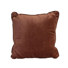 a brown pillow sitting on top of a white wall