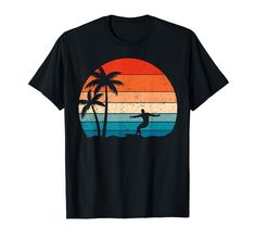 a man riding a surfboard on top of a palm tree in front of an orange sunset