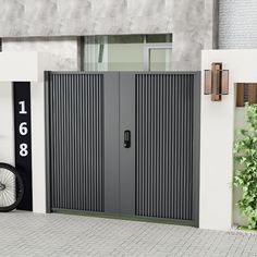 two bicycles are parked in front of an entrance to a building with large metal doors